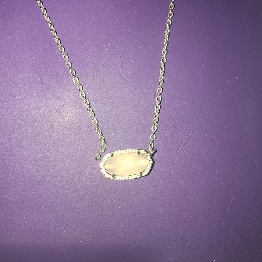 Kendra Scott Gold Necklace with a Rose Gold stone.